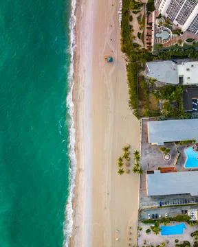 Epic drone top down view of shore line at miami beach with beautiful water Photos