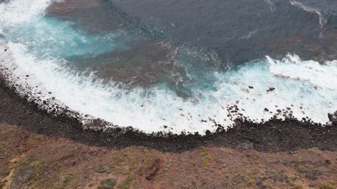 Epic drone video - beach with black stones and turquoise water. El Pris Stock Footage 109197215