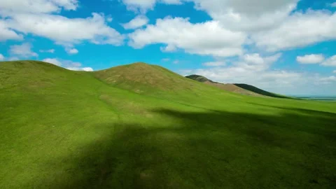 Epic Drone View of Cloud Shadows Drifting Across Vast Prairies Stock Footage 304313108