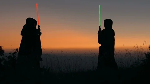 Epic duel with light swords between two Warrior Stock Footage 123628520