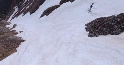 Epic Dynamic Fpv Aerial Following A Man Skiing Down In The Mountains Stock Footage 252651293