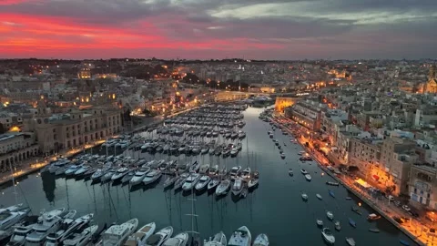 Epic evening shot of old town with churches and marina with yacht in Malta Video stock 259616336
