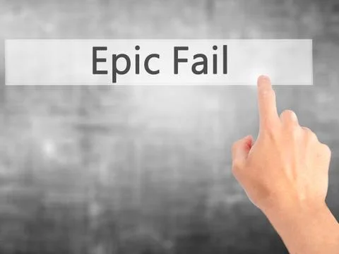 Epic Fail - Hand pressing a button on blurred background concept on visual sc Stock Photos