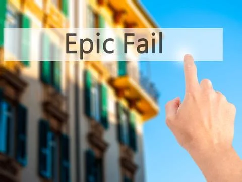 Epic Fail - Hand pressing a button on blurred background concept on visual sc Stock Photos