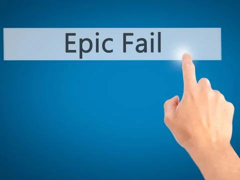 Epic Fail - Hand pressing a button on blurred background concept on visual sc Stock Photos