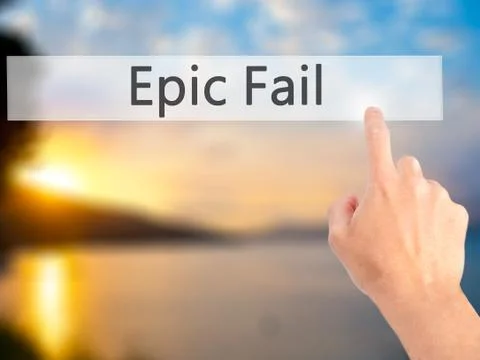 Epic Fail - Hand pressing a button on blurred background concept on visual sc 写真素材