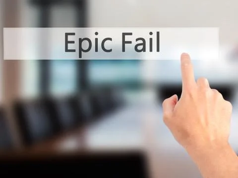 Epic Fail - Hand pressing a button on blurred background concept on visual sc Stock Photos