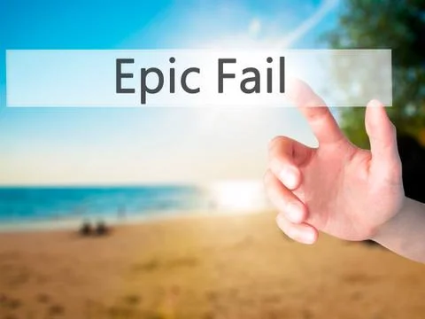 Epic Fail - Hand pressing a button on blurred background concept on visual sc Stock Photos