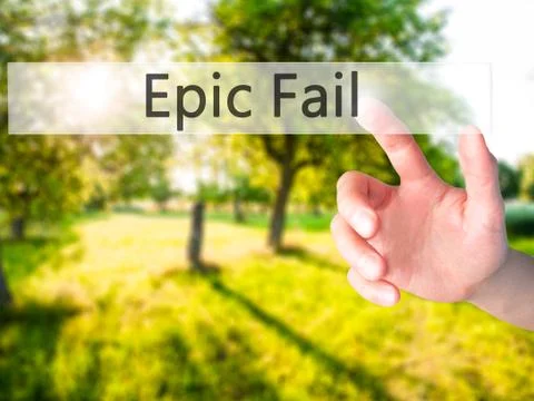 Epic Fail - Hand pressing a button on blurred background concept on visual sc 写真素材