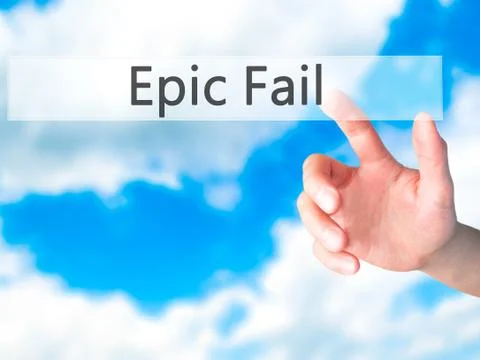 Epic Fail - Hand pressing a button on blurred background concept on visual sc Stock Photos