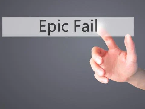 Epic Fail - Hand pressing a button on blurred background concept on visual sc Stock Photos
