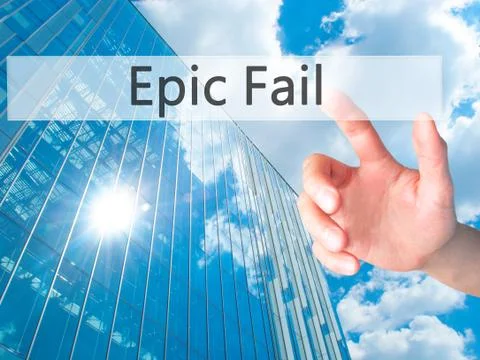 Epic Fail - Hand pressing a button on blurred background concept on visual sc Stock Photos