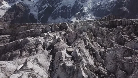 Epic flight above thousands cracks of Mizhirgi glacier in Caucasus mountains Stock Footage 194436743
