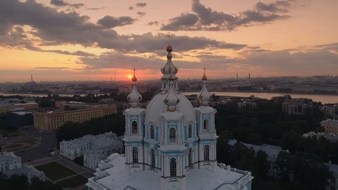 Epic flight between domes Smolny Cathedral St. Petersburg epic sunset cityscape  Stock Footage 129926213