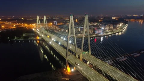 Epic flight Petersburg cable-stayed bridge pylons cityscape night illumination Stock Footage 128749074