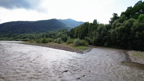 Epic flight under mountain river bridge with panoramic view Stock Footage 262645728