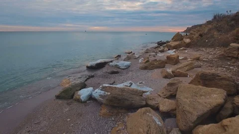 Epic flying drone to over the winter beach during a beautiful pink sunset. 4K. Stock Footage 71093882