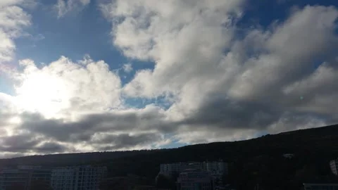 Epic flying over cloudy sky above hills at sunset light Stock Footage 320790793