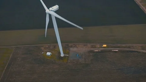 Epic flying over a wind turbine at sunset .4K. Video stock 69967970