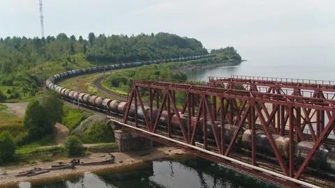 Epic flying view. bridge road. street train traffic transportation. lake river Stock Footage 90064719