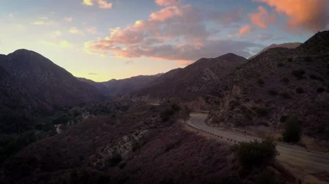 Epic Flyover Empty roads in the mountains at Sunset Video stock 49780544