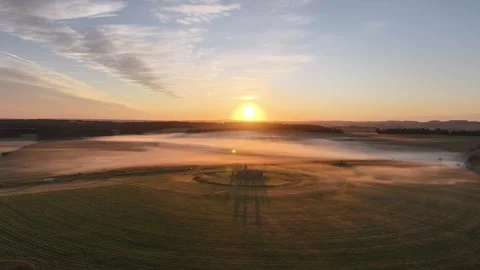 Epic Flyover of Stonehenge on Summer Solstice, Misty Drone Sunrise Clip 4K  Stock Footage 331738987