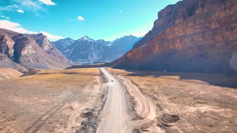Epic Forward Motion Aerial of SUV Traversing Rugged High-Altitude Landscape Video stock 333063705