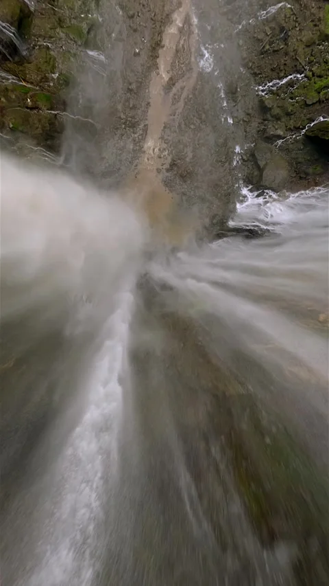 Epic FPV drone dive through powerful Tumpak Sewu waterfall in Indonesia Video stock 315272823
