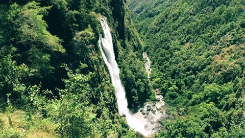 Epic gigantic waterfall surrounded with green forest scenic spot natural mountai Stock Footage