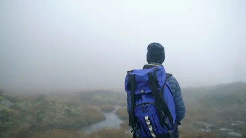 Epic guy in marsh fog Stock Footage 99539803