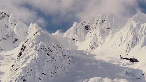 Epic Helicopter Flying Through Snow Capped Mountain Range Stock Footage 72822622
