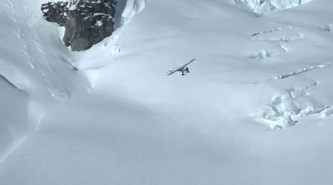 Epic High Mountain Search and Rescue Plane Cruising Stock Footage