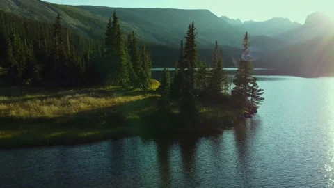 Epic high speed drone shot of a Rocky Mountain lake 스톡 동영상 219966736