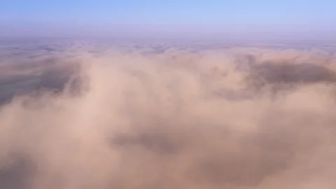 Epic hyperlapse drone flying through paradise cloudscape at sunrise or sunset 4K Stock Footage 261639464