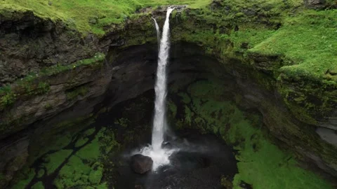 Epic Iceland Waterfall Drone From Base Over Cliffs to Birds Eye View Stock Footage 256690696