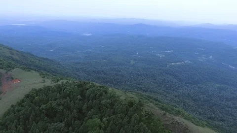 Epic landscape view of mountain top with forest and downhill Видео 90895544