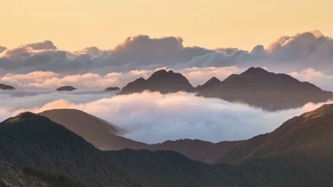 Epic misty clouds over alpine mountains in peaceful evening nature Time lapse Stock Footage 112075396