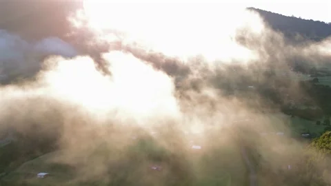 Epic Morning Drone Flight Above Clouds Over Sunlit Mountain Valley Stock-Footage 334320862