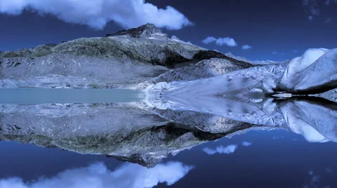 Epic mountain landscape scenery reflecting in lake water Stock-Footage 64536880