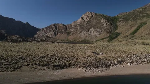 Epic Mountain Range with Camp Ground and Lake Video stock 137980574