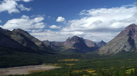 EPIC MOUNTAIN RANGE TIMELAPSE WITH GLACIAL VALLEY BELOW Stock Footage 59069015