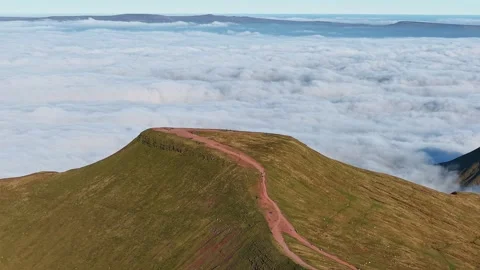 Epic Mountain Summit Above a Sea of Clouds at Dusk Stock Footage 319077541