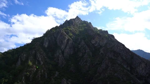 Epic mountain on a sunny day with clouds. Stock Footage 124584914
