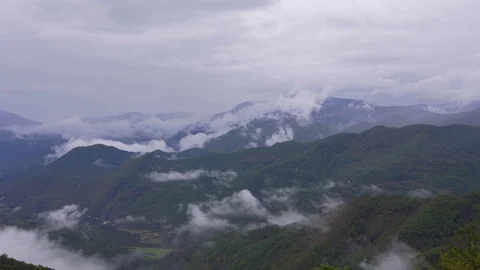 Epic mountain view covered with clouds Stock Footage 126064945
