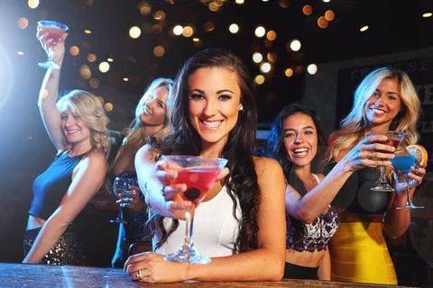 Epic night out with the girls. young women partying in a nightclub. Stock Photos