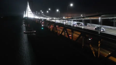 Epic night shot of cable bridge illuminated in white lights in the dark, 4K Stock Footage 136803534