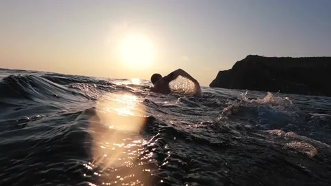 Epic open ocean swim. Professional triathlon swimmer athlete practicing Stock Footage 159792832
