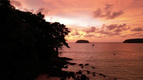 Epic orange sunset with island view and clouds Video stock 184286118