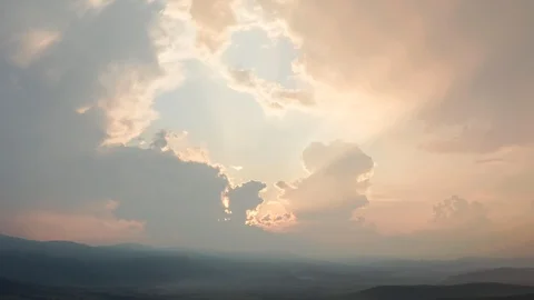 Epic orange sunset through a hole in the clouds Stock Footage 120700579