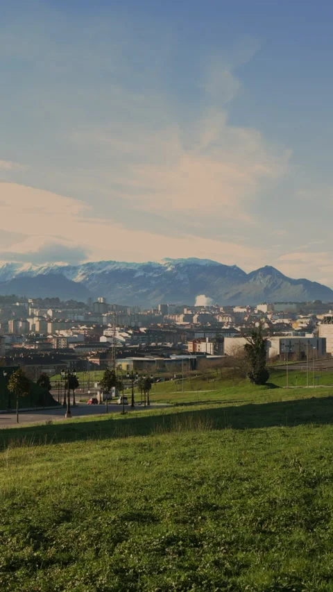 Epic panoramic view of Oviedo city with snowy Picos de Europa mountains in Spain Video stock 338029166